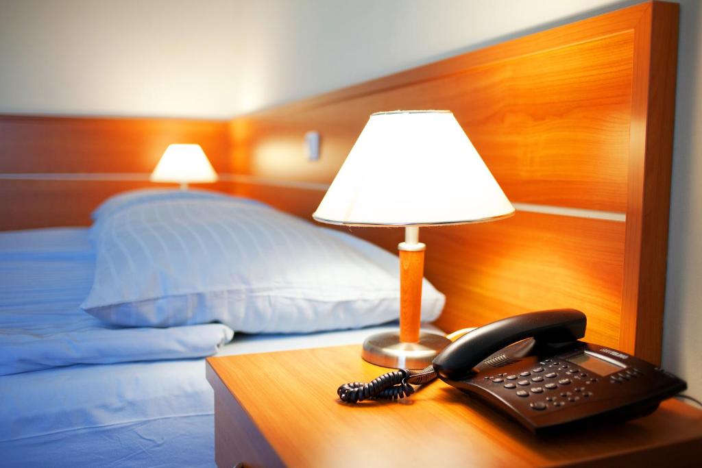 Postel nebo postele na pokoji v ubytování Hotel Creina