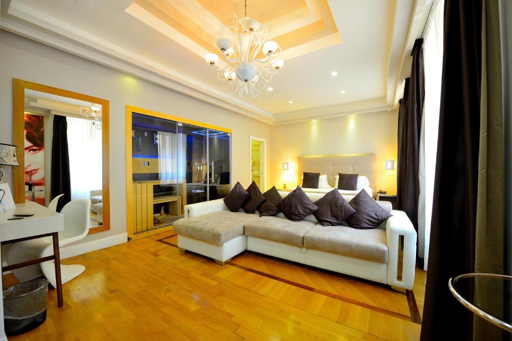 Łóżko lub łóżka w pokoju w obiekcie Terrazza Marco Antonio Luxury Suite