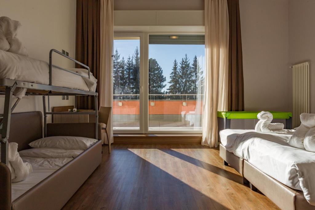 Postel nebo postele na pokoji v ubytování Hotel Milano