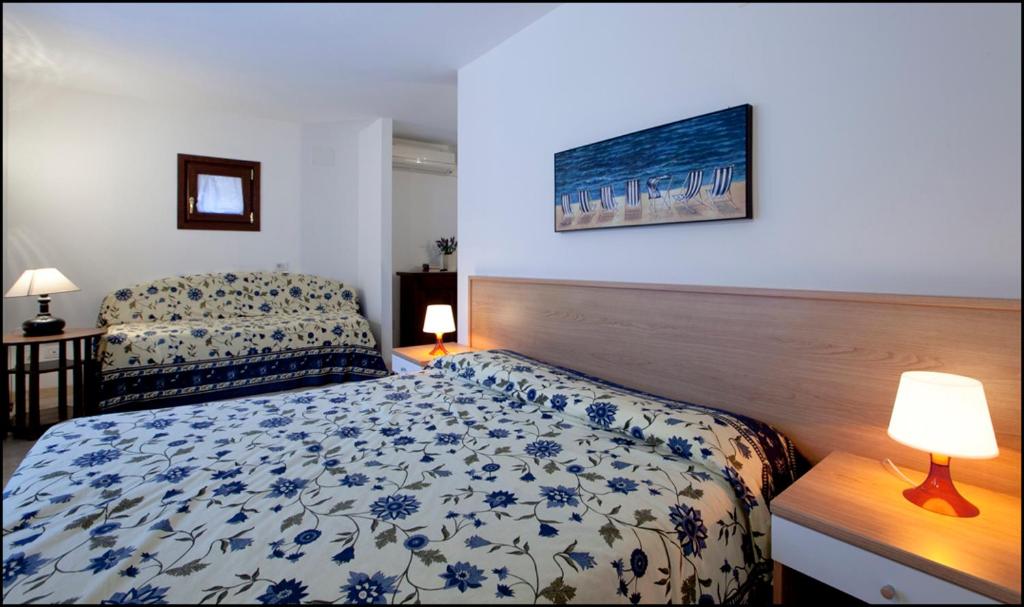 Postel nebo postele na pokoji v ubytování Villa Berghinz