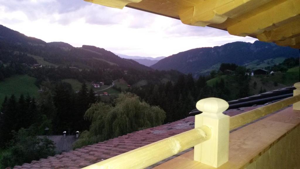 a view of the mountains from the balcony of a house at Pension Biobauernhof Hinteraltensberg in Auffach