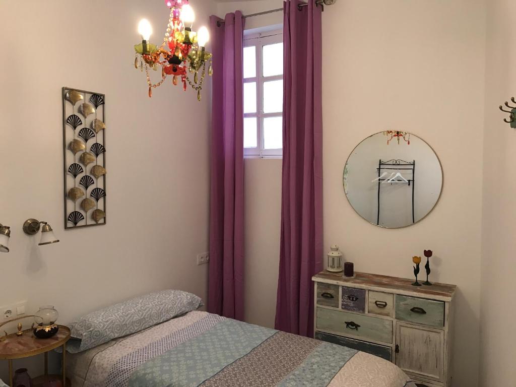 Posteľ alebo postele v izbe v ubytovaní Apartamento Aromas del Mercado