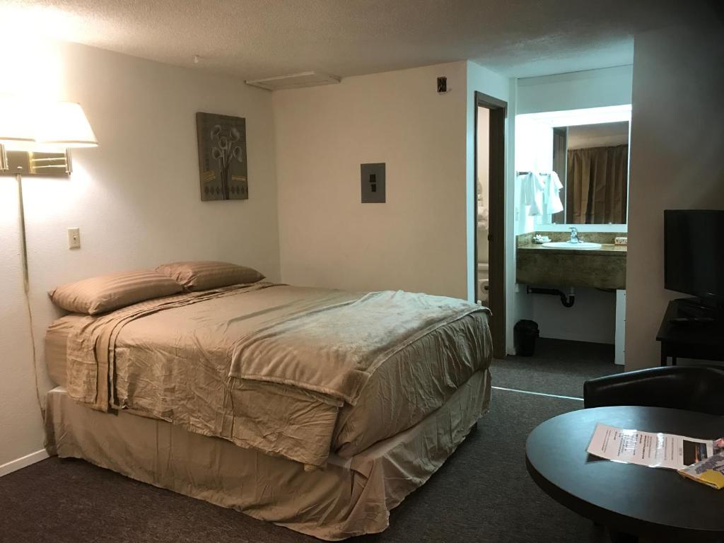Katil atau katil-katil dalam bilik di Sunset Inn