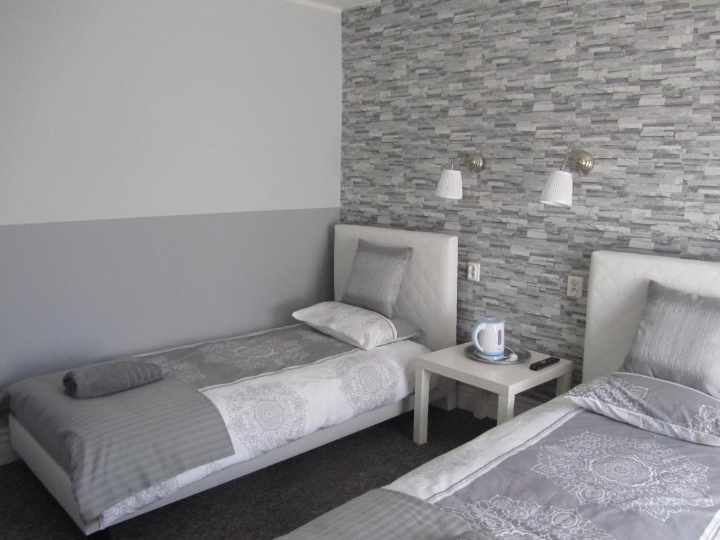 Posteľ alebo postele v izbe v ubytovaní White Home Room