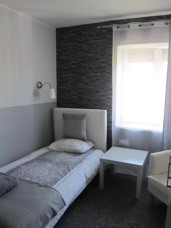 Posteľ alebo postele v izbe v ubytovaní White Home Room