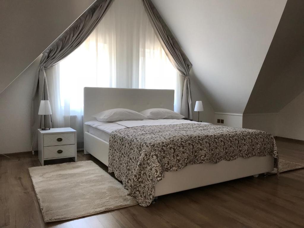 
Кровать или кровати в номере Robertina Гостевой Дом
