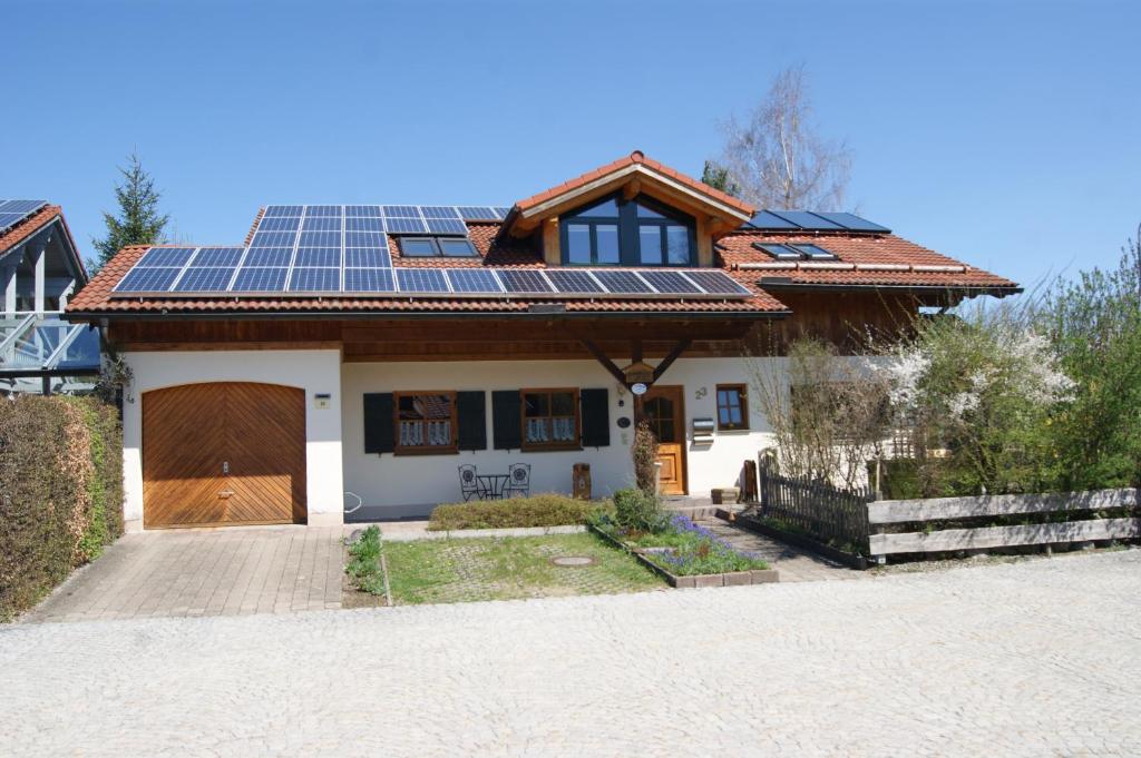 a house with solar panels on the roof at Landhaus Lex in Füssen