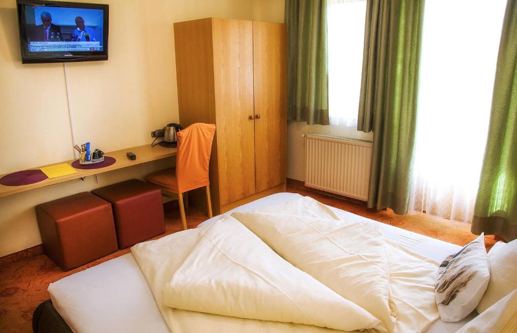 Postel nebo postele na pokoji v ubytování Gästehaus Götz