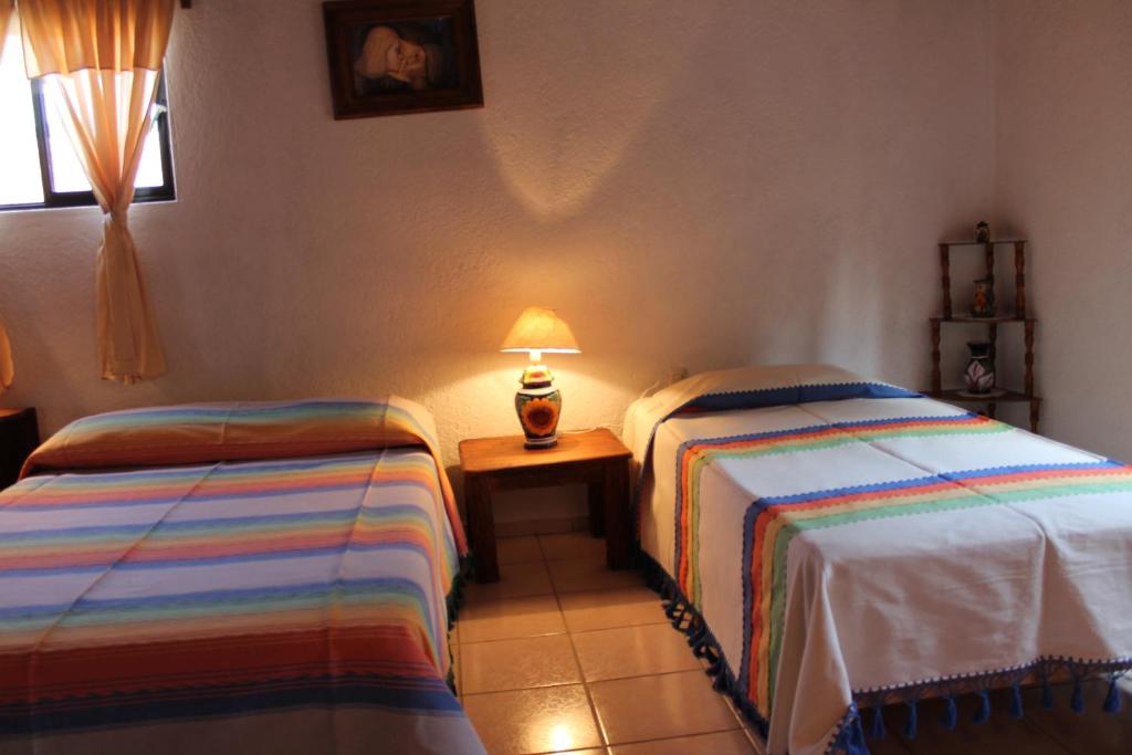 Postel nebo postele na pokoji v ubytování Manzano B&B