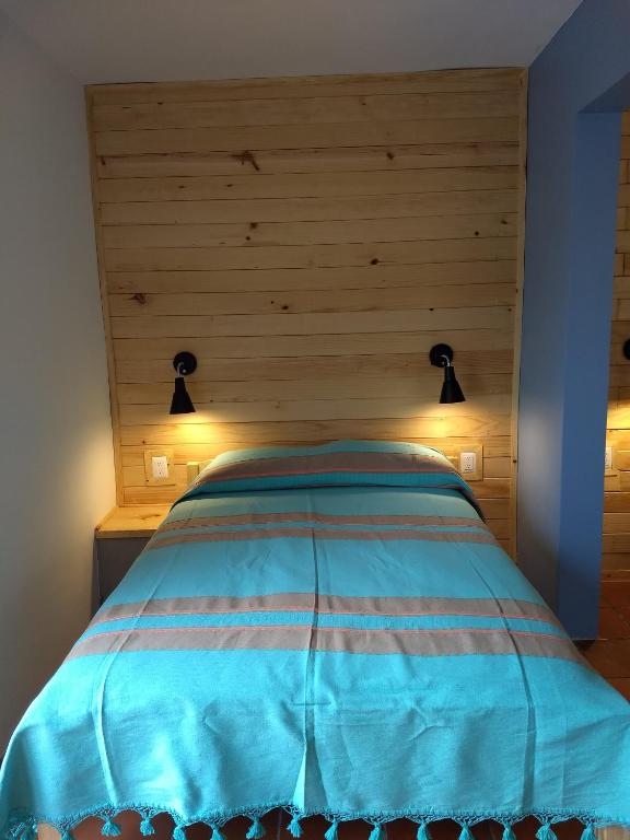 Postel nebo postele na pokoji v ubytování La Abuelita Hostal