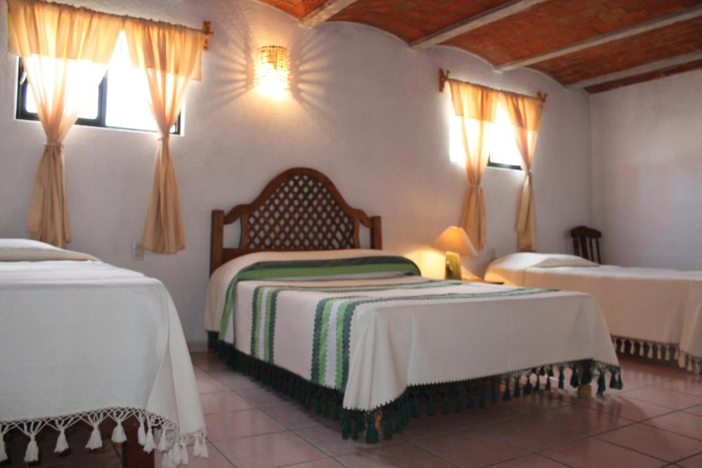 Postel nebo postele na pokoji v ubytování Manzano B&B