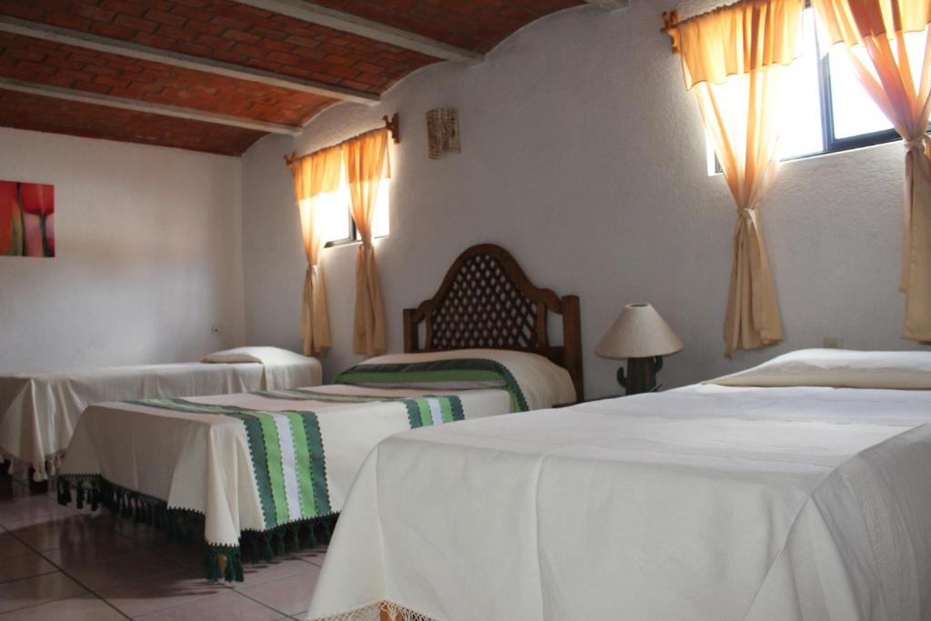 Postel nebo postele na pokoji v ubytování Manzano B&B