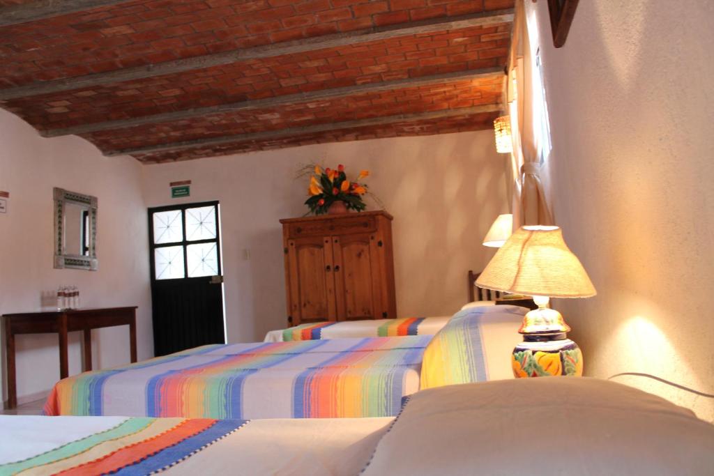Postel nebo postele na pokoji v ubytování Manzano B&B