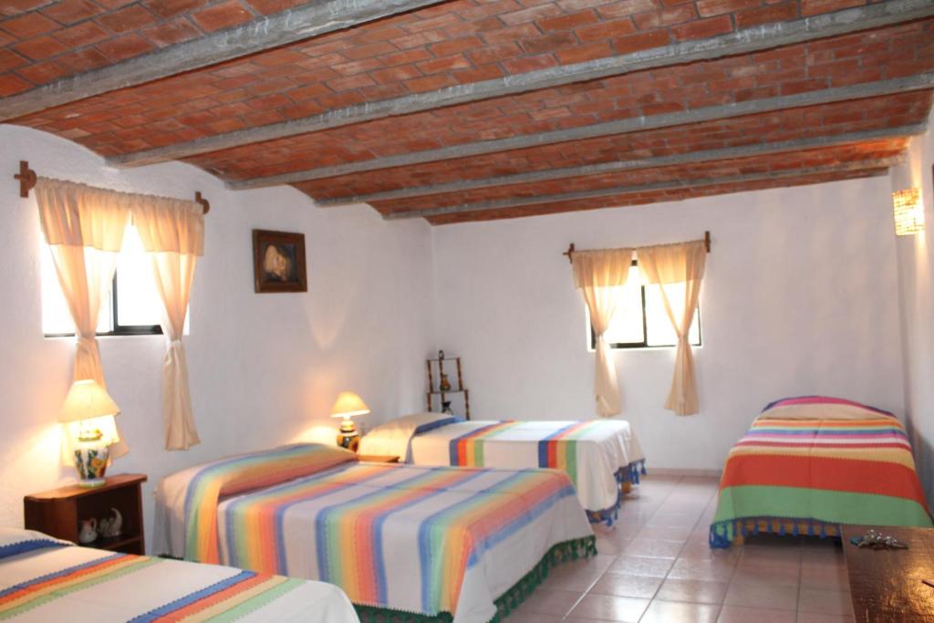 Postel nebo postele na pokoji v ubytování Manzano B&B