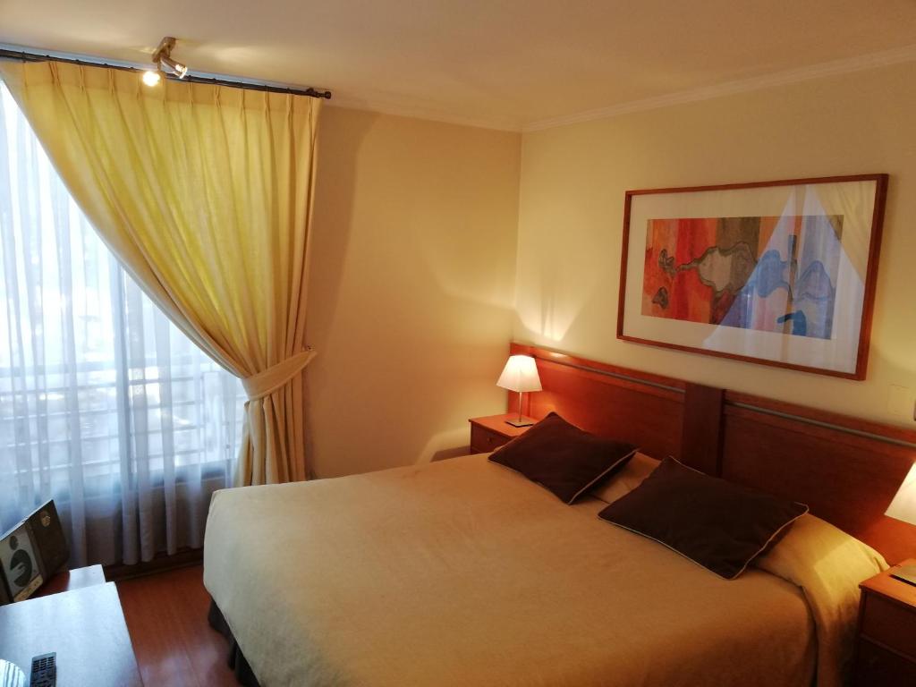 Postel nebo postele na pokoji v ubytování Andes Suites