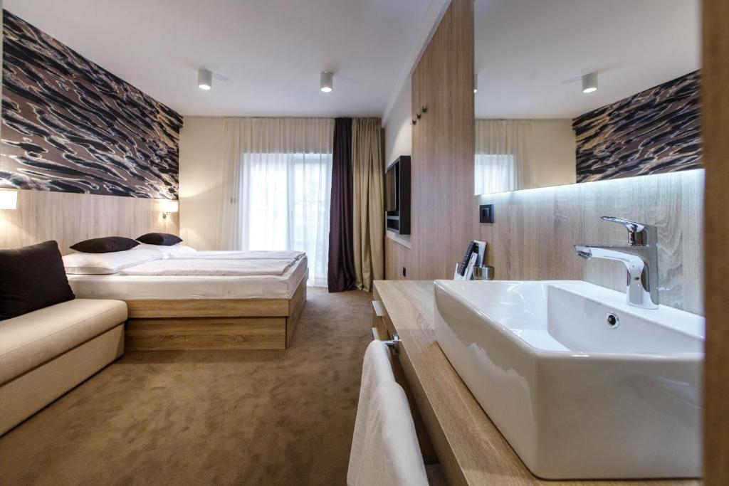 Postel nebo postele na pokoji v ubytování Luxury Suites Bellevue