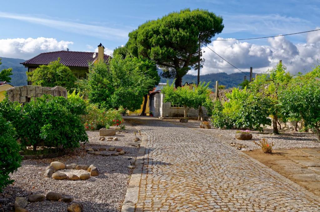 a cobblestone path in front of a house at Zen Vouga in Ribeiradio