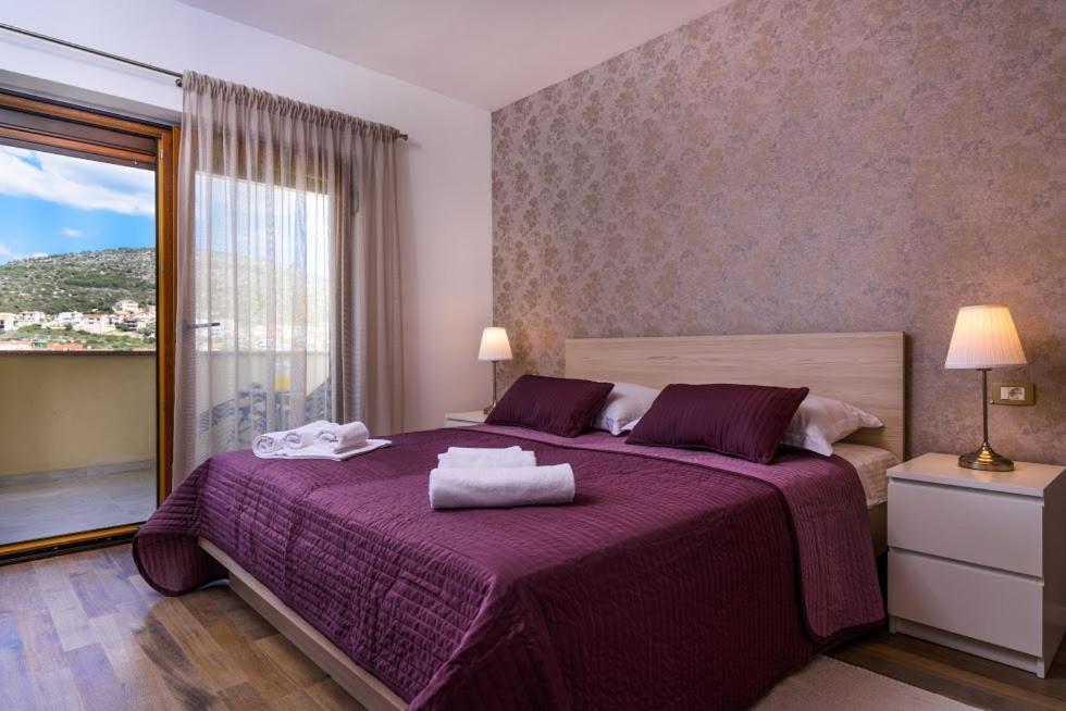 Posteľ alebo postele v izbe v ubytovaní Apartmani Marko i Ana