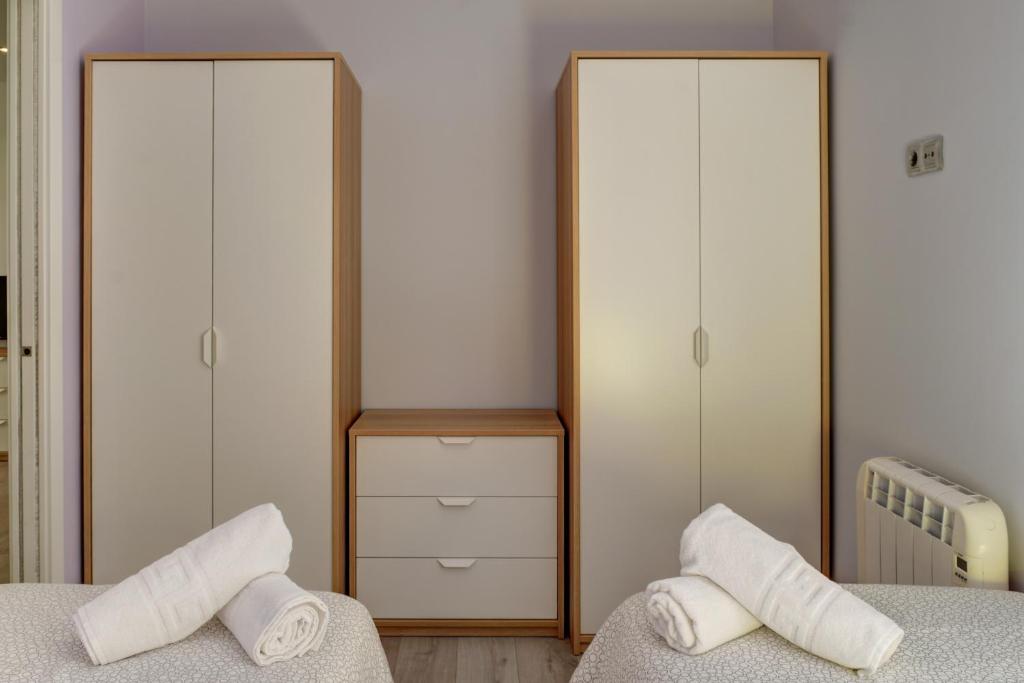 Postel nebo postele na pokoji v ubytování Apartamentos San Lázaro 2