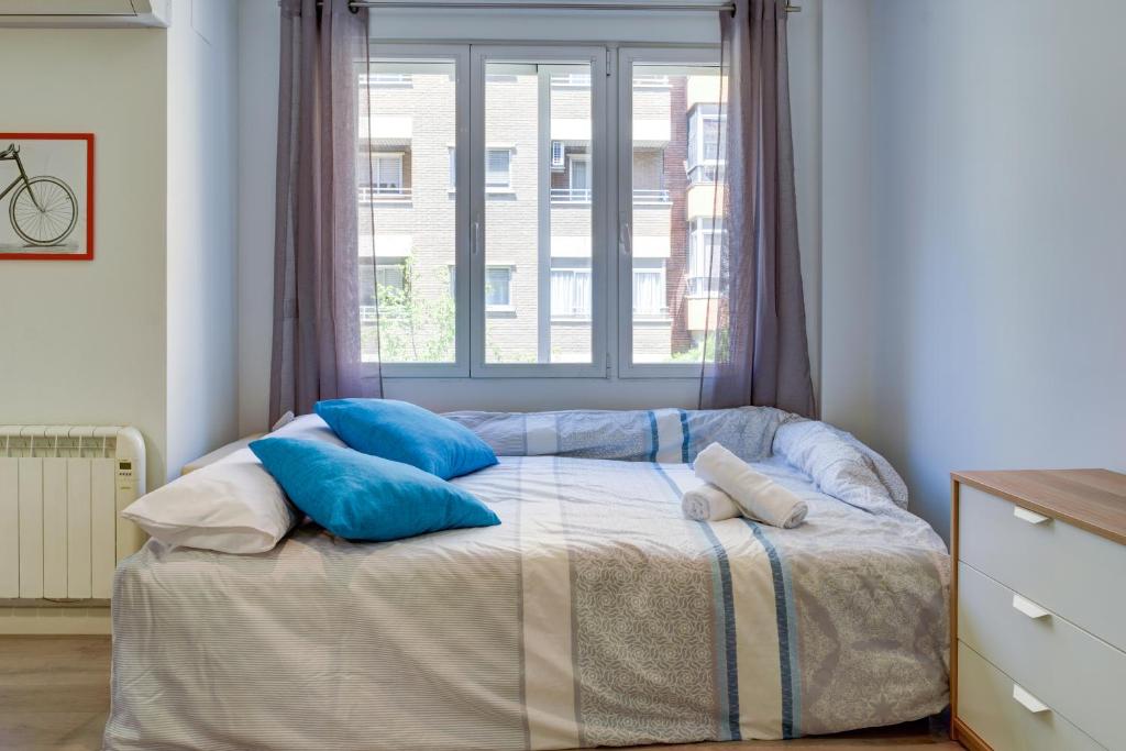Postel nebo postele na pokoji v ubytování Apartamentos San Lázaro 2