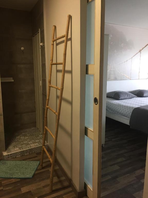 Postel nebo postele na pokoji v ubytování 1 Chambre, 1 P'tit dèj', 1 Sourire
