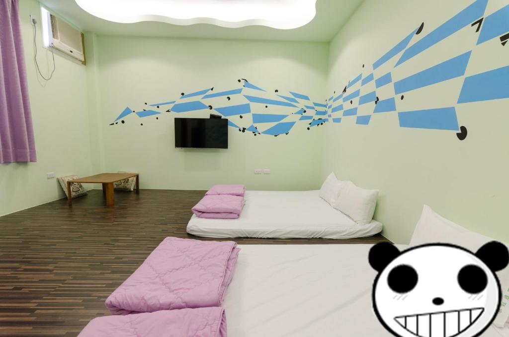 Postel nebo postele na pokoji v ubytování Mu Yu B&B