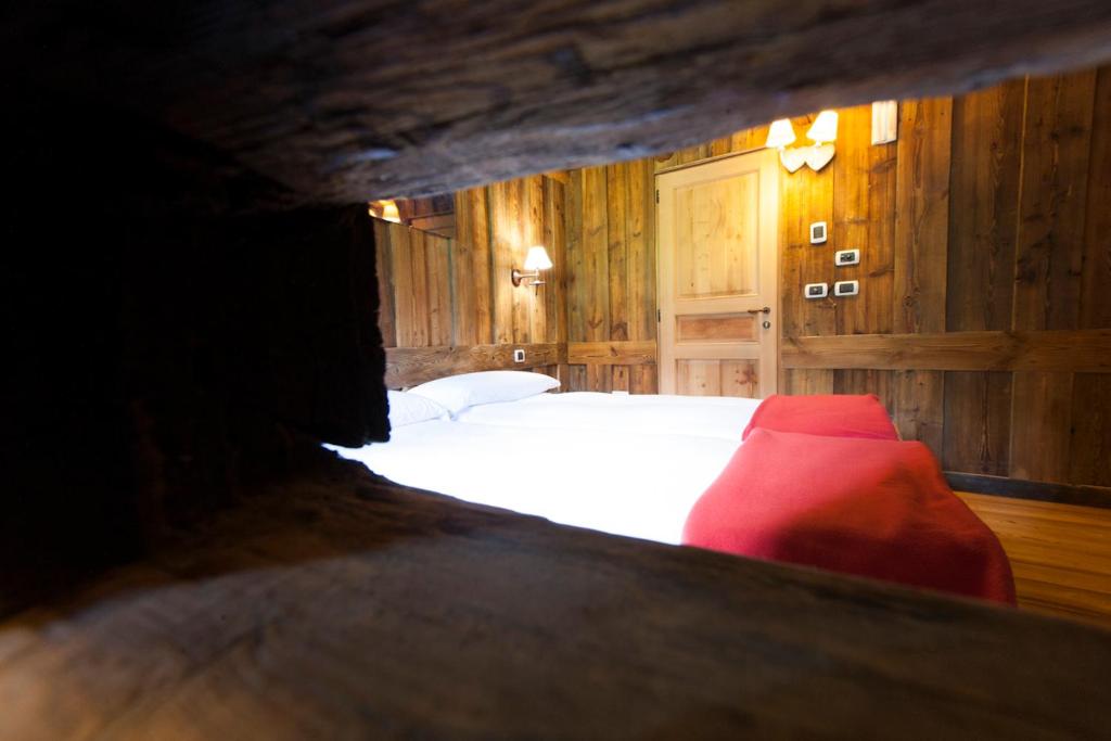 Postel nebo postele na pokoji v ubytování L' Aroula Rooms & Restaurant
