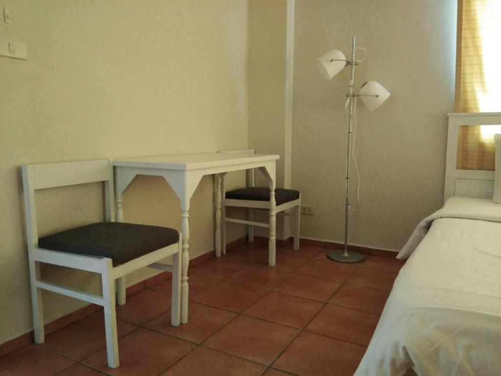 Postel nebo postele na pokoji v ubytování Lomsabai Apartments