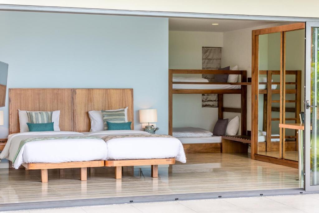 Postel nebo postele na pokoji v ubytování Villa SeaNest Samui