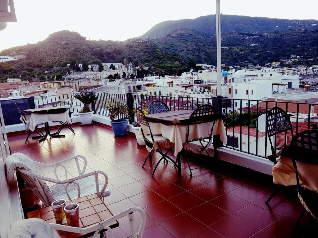 a patio with a table and chairs on a balcony at Lo Nardo Accommodation in Lipari