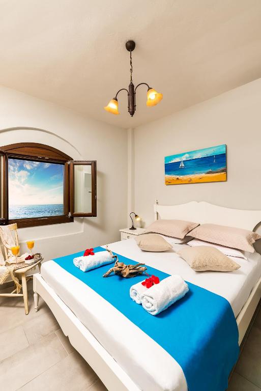 Postel nebo postele na pokoji v ubytování Oceanides Luxury Apartments