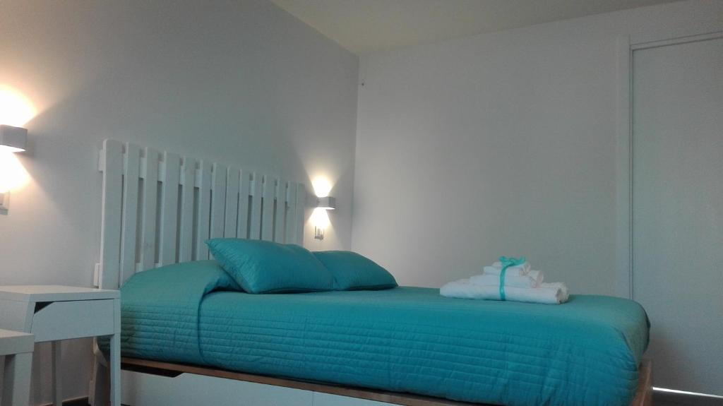 Łóżko lub łóżka w pokoju w obiekcie Tivoli ShortLets - Catania