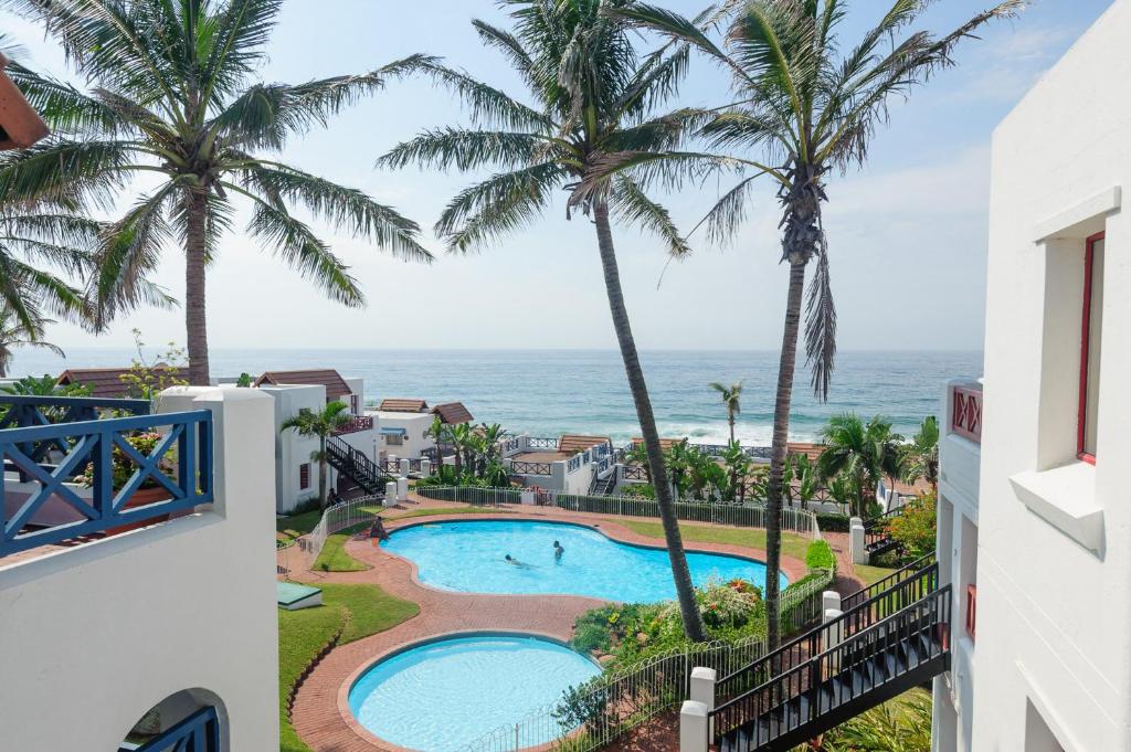 a view of the ocean from the balcony of a resort at Le Paradis 30 in Ballito