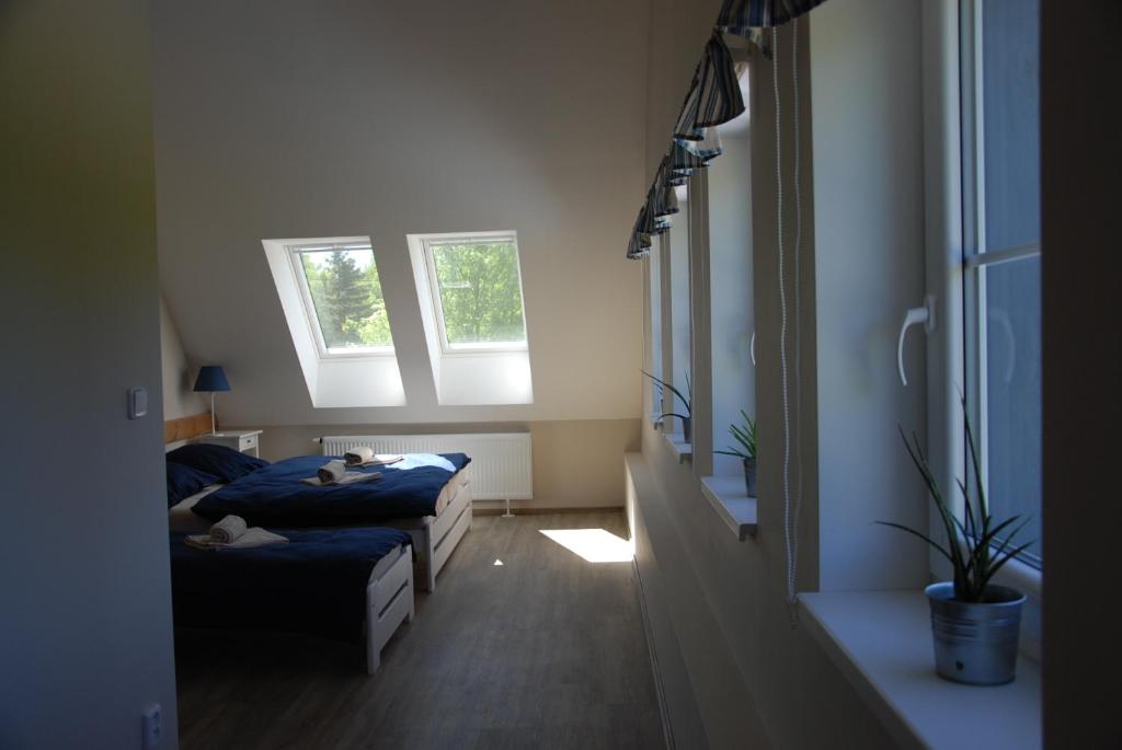 Postel nebo postele na pokoji v ubytování Apartment Ptačí Dům
