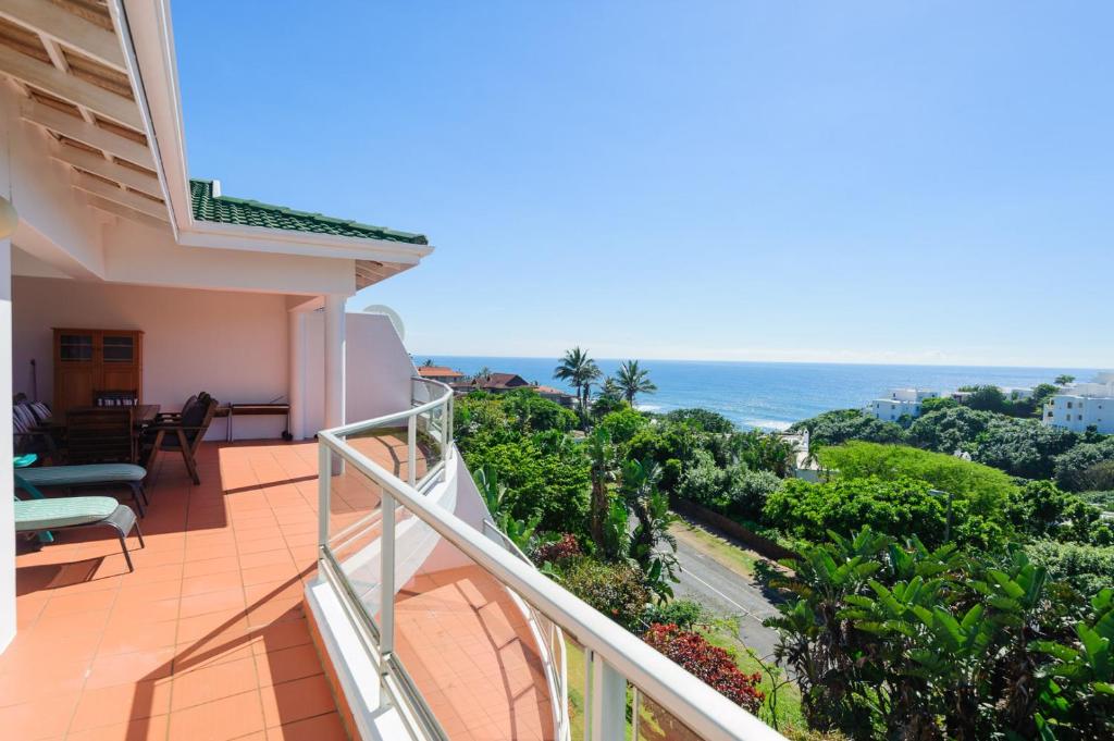 a balcony with a view of the ocean at Long Island 11 - FAMILY ONLY in Ballito