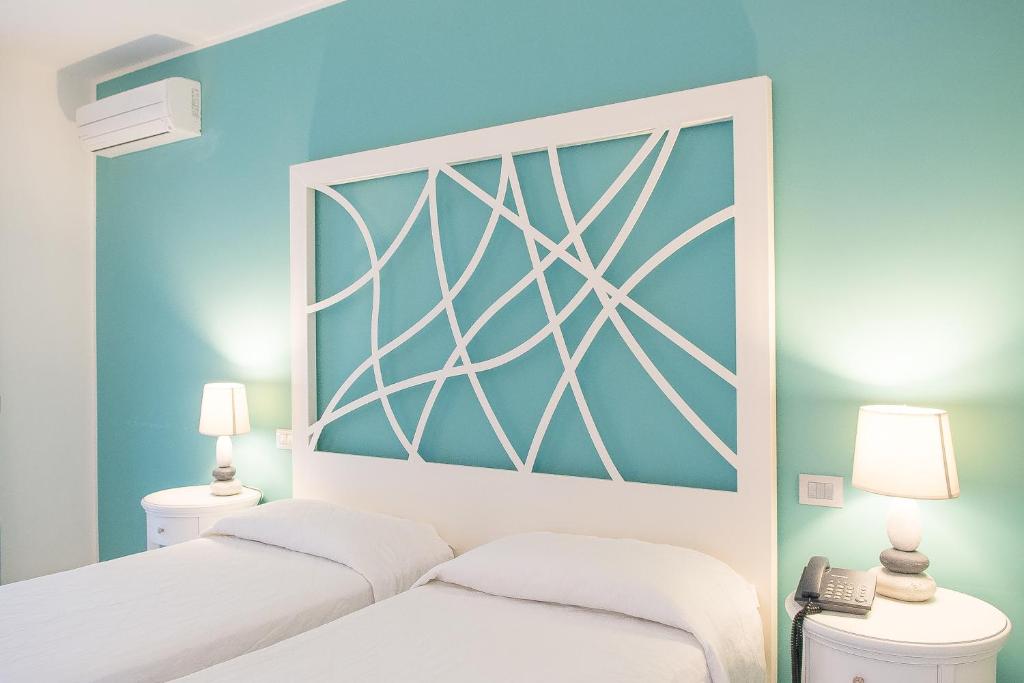 Postel nebo postele na pokoji v ubytování Hotel Cutimare - Aeolian Charme