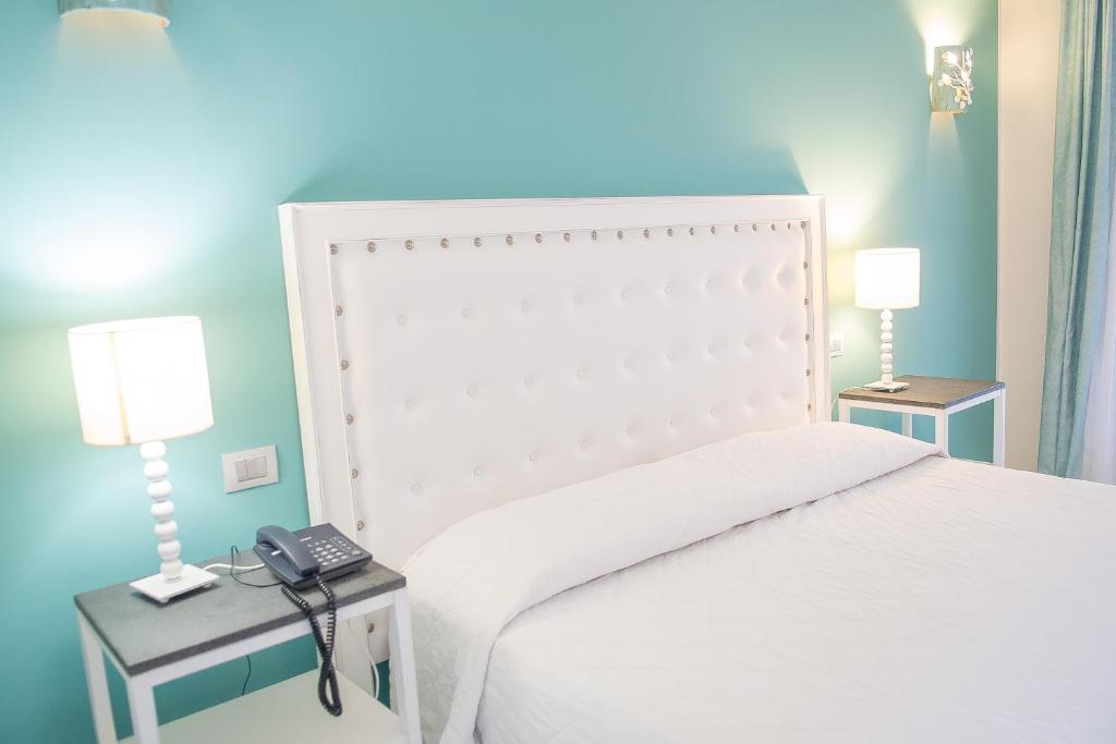Postel nebo postele na pokoji v ubytování Hotel Cutimare - Aeolian Charme