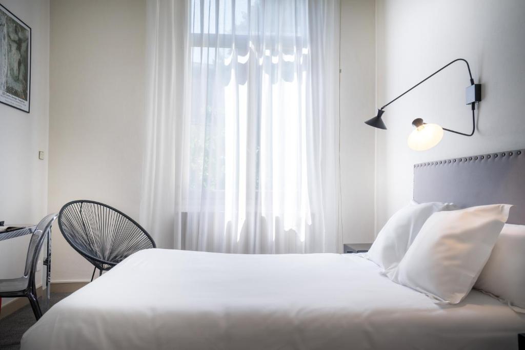 Postel nebo postele na pokoji v ubytování Hotel d'Angleterre