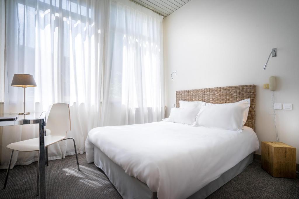 Postel nebo postele na pokoji v ubytování Hotel d'Angleterre