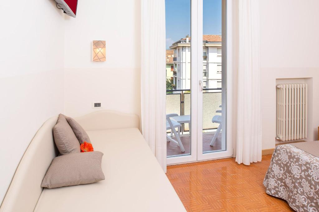Postel nebo postele na pokoji v ubytování Hotel Taormina