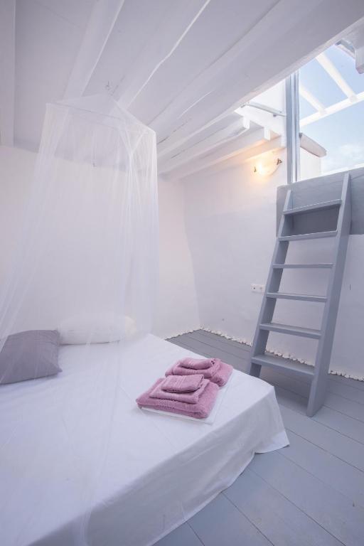 Posteľ alebo postele v izbe v ubytovaní Melina's House Mykonos Town