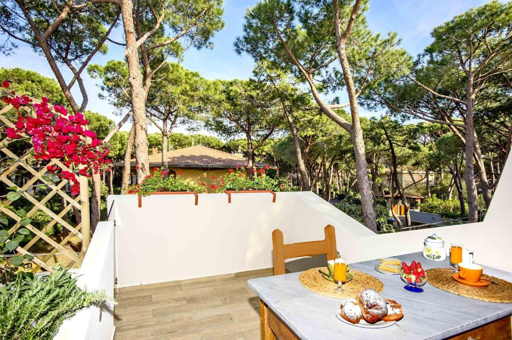 a patio with a table with food on it at Lara Elite in Castiglione della Pescaia