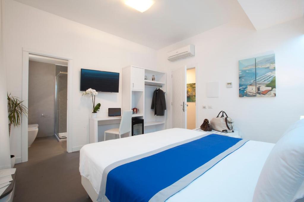 Postel nebo postele na pokoji v ubytování Hotel Tasso Suites & Spa