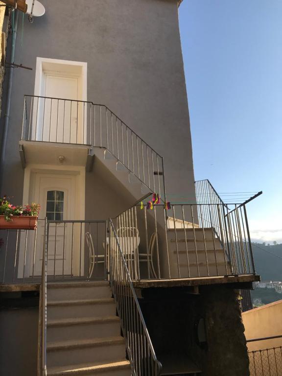 a set of stairs leading up to a building at Maison entière tout équipé 4 chambre possibilité de 10 couchage Venaco Centre Corse in Venaco