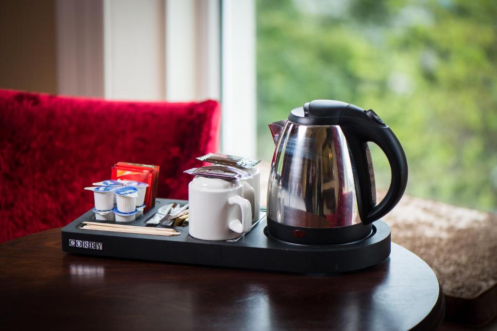 a tea kettle on a tray on a table at Gabriel House Guesthouse in Cork