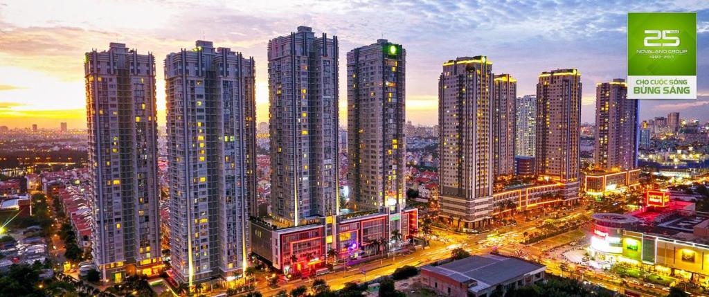 a group of tall buildings in a city at night at Sunrise City - 5 star in Ho Chi Minh City
