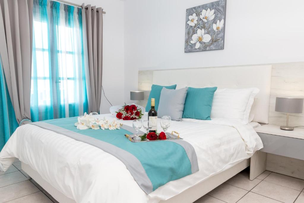 Postel nebo postele na pokoji v ubytování Margarita Hotel