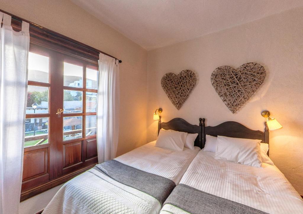A bed or beds in a room at Apartamentos Rurales Islas Canarias