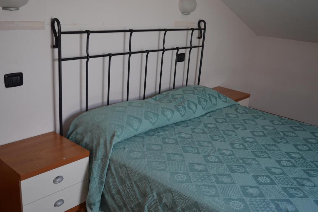 A bed or beds in a room at Residenza Villa Margherita