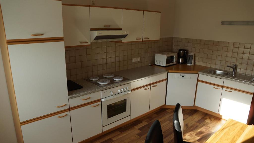 Kuchyň nebo kuchyňský kout v ubytování Apartment Köll